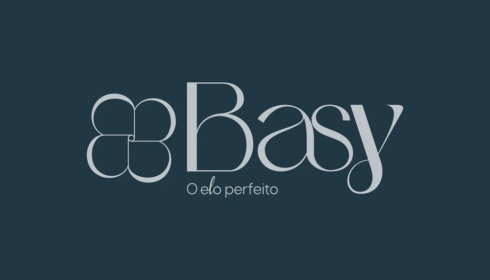 Logo da Basy com o trevo e a assinatura O elo perfeito, em cinza sobre azul petróleo